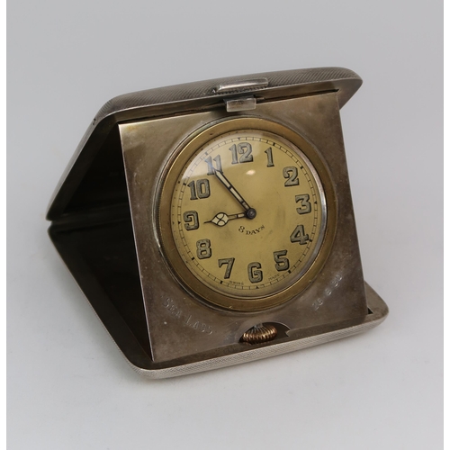 2479 - A GEORGE V SILVER MOUNTED TRAVELLING CLOCKthe case by William Base & Sons, Birmingham 1928, of c... 