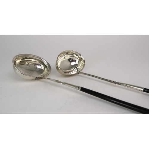 2481 - TWO GEORGIAN WHITE METAL TODDY LADLESboth with oval shaped bowls and turned whalebone handles, one m... 