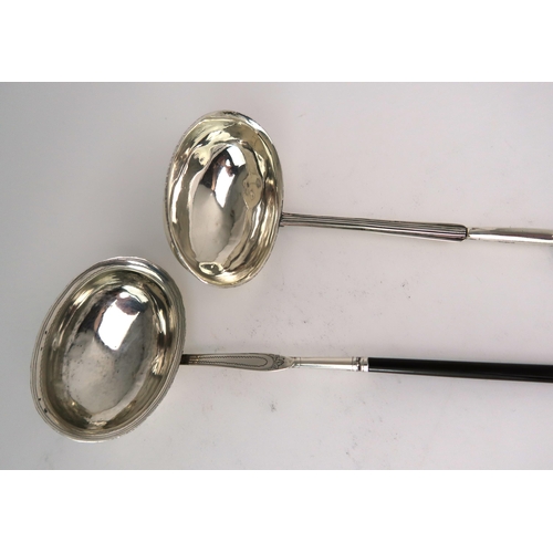 2481 - TWO GEORGIAN WHITE METAL TODDY LADLESboth with oval shaped bowls and turned whalebone handles, one m... 