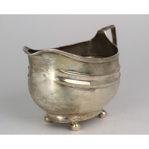 2482 - A GEORGE III SILVER CREAM JUGmaker's mark rubbed, London 1806, of oval form, with two shaped bands, ... 