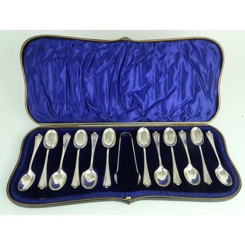 2493 - A CASED SET OF EDWARDIAN SILVER TEASPOONS AND SUGAR TONGSby John Round & Sons, Sheffield 1902, o... 