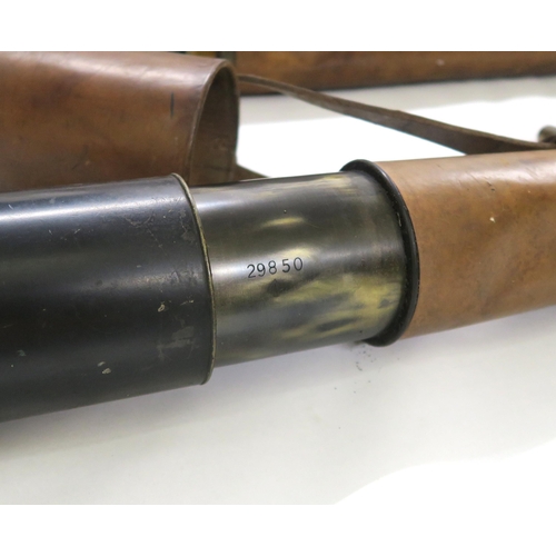 2614 - A MATCHED PAIR OF MILITARY FIELD TELESCOPESProbably WW1-era, two-draw with leather-clad tubes, one b... 