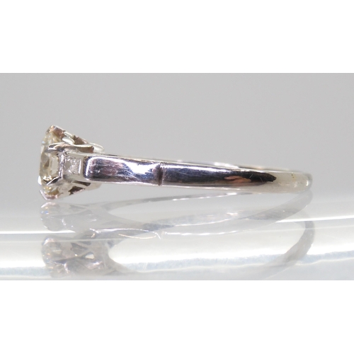 2703 - A CLASSIC VINTAGE DIAMOND RINGset with an estimated approx 0.58ct brilliant cut diamond, with furthe... 