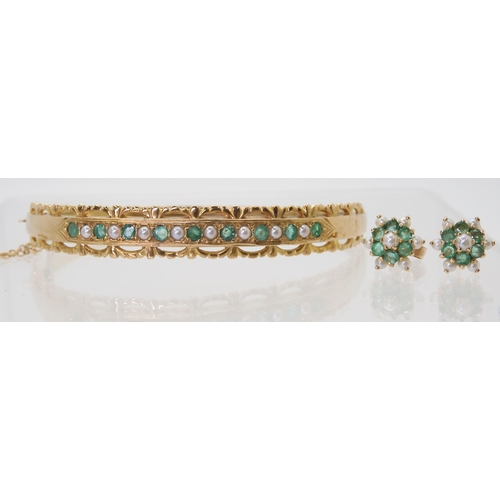 2709 - AN EMERALD & PEARL BANGLE AND EARRINGSthe 9ct bangle is set with alternate emeralds and pearls w... 