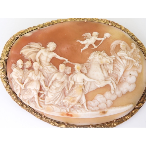 2715 - A LARGE CLASSICAL THEMED CAMEOthe well carved shell cameo depicting Apollo in his horse drawn chario... 