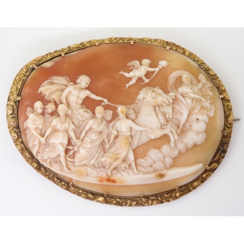 2715 - A LARGE CLASSICAL THEMED CAMEOthe well carved shell cameo depicting Apollo in his horse drawn chario... 