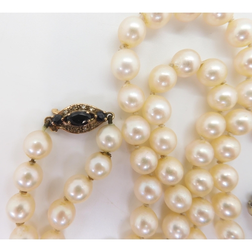 2716 - TWO STRINGS OF PEARLS WITH DECORATIVE CLASPSthe smaller strand, the pearls taper in size from 7mm to... 