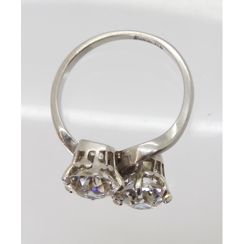 2720 - A SUBSTANTIAL TWIN STONE DIAMOND RINGset with two old cut diamonds with an estimated approx diamond ... 