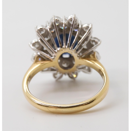 2721 - A SAPPHIRE AND DIAMOND CLUSTER RINGthe 16.8mm x 18mm cluster, mounted throughout in yellow and white... 