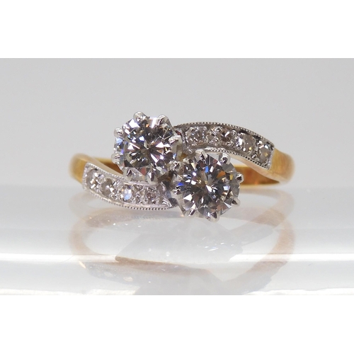 2723 - A CLASSIC TWIN STONE DIAMOND RINGmounted in 18ct yellow gold and platinum, set with estimated approx... 