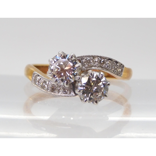 2723 - A CLASSIC TWIN STONE DIAMOND RINGmounted in 18ct yellow gold and platinum, set with estimated approx... 