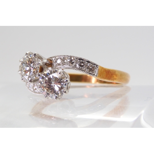 2723 - A CLASSIC TWIN STONE DIAMOND RINGmounted in 18ct yellow gold and platinum, set with estimated approx... 