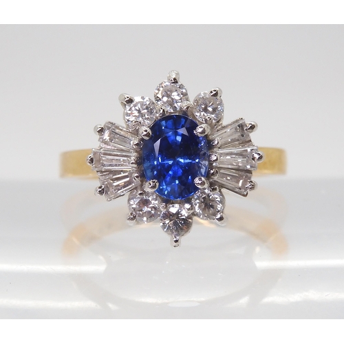 2724 - A SAPPHIRE & DIAMOND CLUSTER RINGset in 18ct yellow and white gold, the starburst configuration ... 