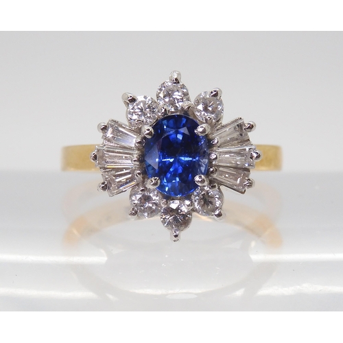 2724 - A SAPPHIRE & DIAMOND CLUSTER RINGset in 18ct yellow and white gold, the starburst configuration ... 