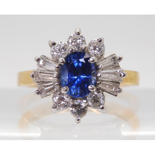 2724 - A SAPPHIRE & DIAMOND CLUSTER RINGset in 18ct yellow and white gold, the starburst configuration ... 