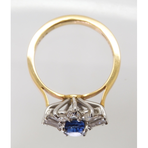 2724 - A SAPPHIRE & DIAMOND CLUSTER RINGset in 18ct yellow and white gold, the starburst configuration ... 