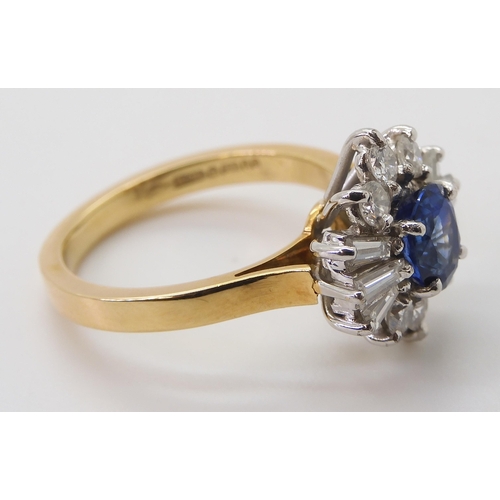 2724 - A SAPPHIRE & DIAMOND CLUSTER RINGset in 18ct yellow and white gold, the starburst configuration ... 