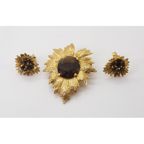 2731 - A RETRO BROOCH AND EARRING SETof 9ct gold leaf forms set with smoky quartz, dimensions of the brooch... 