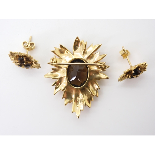 2731 - A RETRO BROOCH AND EARRING SETof 9ct gold leaf forms set with smoky quartz, dimensions of the brooch... 