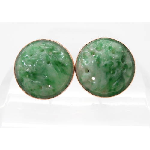 2734 - A PAIR OF CHINESE GREEN HARDSTONE EARRINGScarved with foliage and set in 9ct gold stud earring mount... 