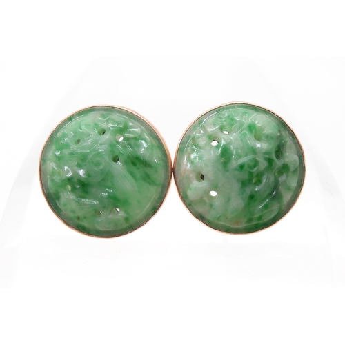 2734 - A PAIR OF CHINESE GREEN HARDSTONE EARRINGScarved with foliage and set in 9ct gold stud earring mount... 