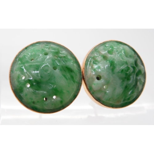 2734 - A PAIR OF CHINESE GREEN HARDSTONE EARRINGScarved with foliage and set in 9ct gold stud earring mount... 