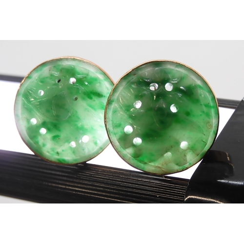 2734 - A PAIR OF CHINESE GREEN HARDSTONE EARRINGScarved with foliage and set in 9ct gold stud earring mount... 