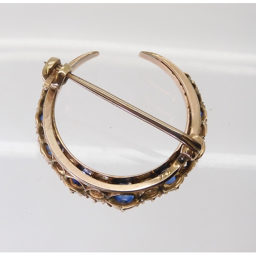 2735 - A SAPPHIRE & DIAMOND MOON BROOCHset throughout in yellow metal with galleried mount, in original... 