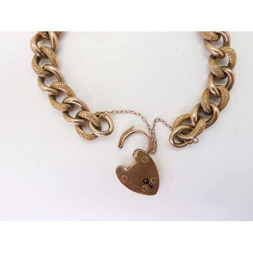 2742 - A 9CT GOLD CURB CHAIN BRACELETwith heart-shaped clasp, hollow construction with alternate links text... 