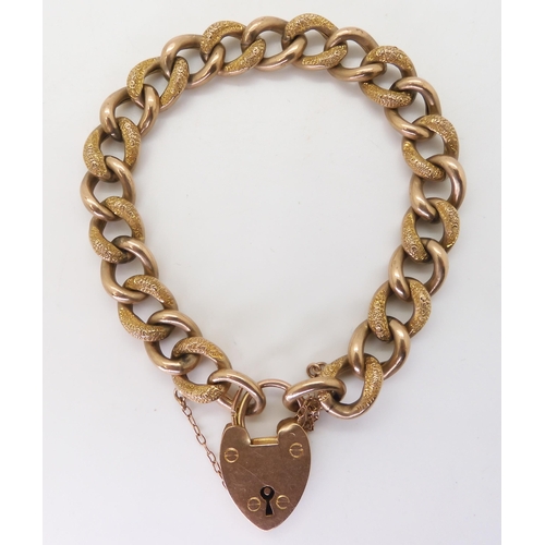 2742 - A 9CT GOLD CURB CHAIN BRACELETwith heart-shaped clasp, hollow construction with alternate links text... 