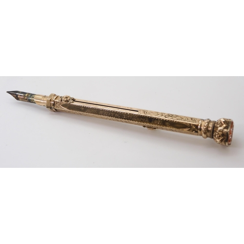 2744 - A PROPELLING PEN & PENCILthe yellow metal body with all over floral and scrolled engraving, with... 