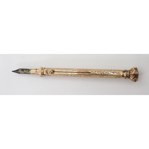 2744 - A PROPELLING PEN & PENCILthe yellow metal body with all over floral and scrolled engraving, with... 