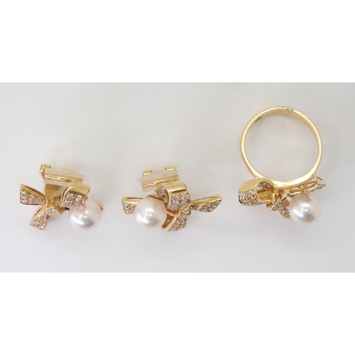 2749 - AN 18CT BOW RING AND EARRING SETset with pearls and pave set diamonds with an estimated approx total... 