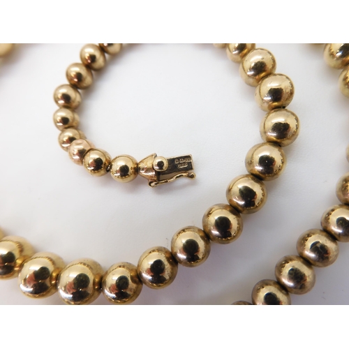2752 - AN ITALIAN CHIAMPESAN BEAD NECKLACEthe tapered in size beads from 11.2mm to 5mm are hollow and strun... 
