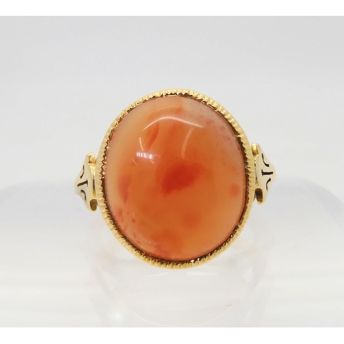 2824 - AN CARNELIAN RINGthe 18ct gold mount has pierced shoulders and a engraved setting. Finger size L, we... 