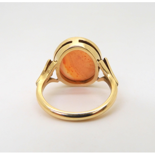 2824 - AN CARNELIAN RINGthe 18ct gold mount has pierced shoulders and a engraved setting. Finger size L, we... 