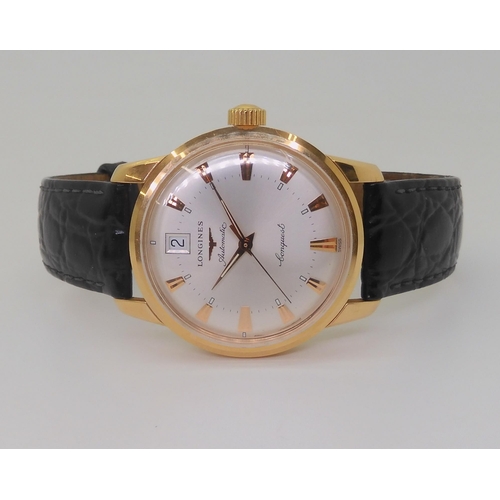 2874 - A LONGINES AUTOMATIC CONQUESTthe 18ct gold model, with silvered dial, gold coloured dagger numerals ... 