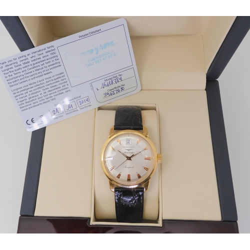 2874 - A LONGINES AUTOMATIC CONQUESTthe 18ct gold model, with silvered dial, gold coloured dagger numerals ... 