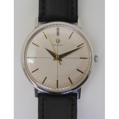 2876 - A VINTAGE OMEGA WRISTWATCHwith a stainless steel case, brushed silvered cross hairs dial with gold c... 