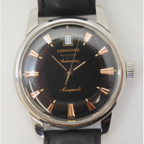 A LONGINES AUTOMATIC CONQUESTwith a black dial gold coloured