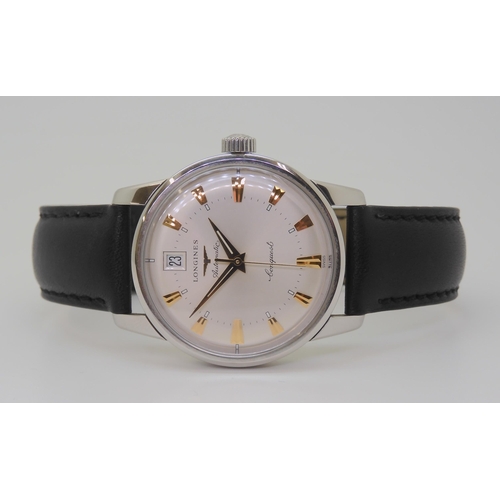 2879 - A LONGINES AUTOMATIC CONQUESTwith a silvered dial gold coloured dagger numerals and hands, with date... 