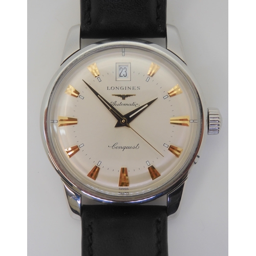 2879 - A LONGINES AUTOMATIC CONQUESTwith a silvered dial gold coloured dagger numerals and hands, with date... 