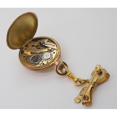 2888 - A 14K GOLD OPEN FACE FOB WATCHwith a decorative French gold transfer patterned dial & blue Roman... 