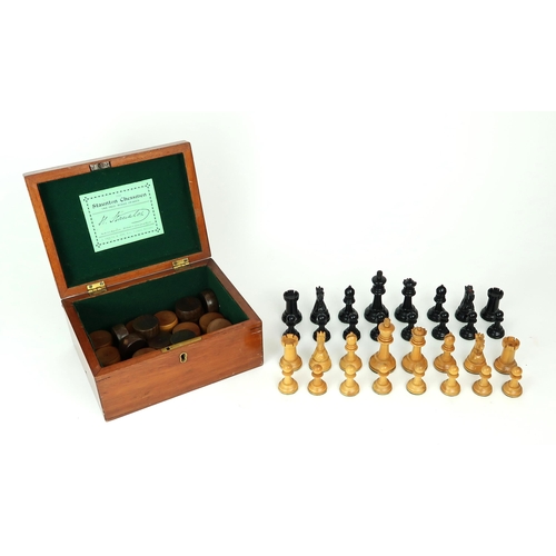 2557 - THE STAUNTON CHESSMEN BY JACQUE & SON, LONDONIn boxwood and ebony, both kings stamped 