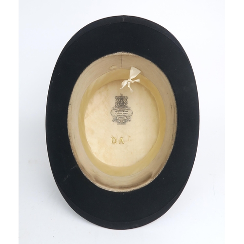 2566 - A SILK TOP HAT BY WOODROW, LIVERPOOLOf medium size, measuring approx. 19.8cm front-to-back x 16cm si... 