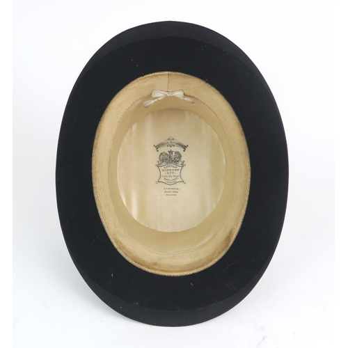 2566 - A SILK TOP HAT BY WOODROW, LIVERPOOLOf medium size, measuring approx. 19.8cm front-to-back x 16cm si... 