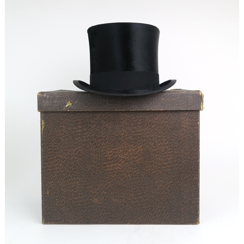 2566 - A SILK TOP HAT BY WOODROW, LIVERPOOLOf medium size, measuring approx. 19.8cm front-to-back x 16cm si... 