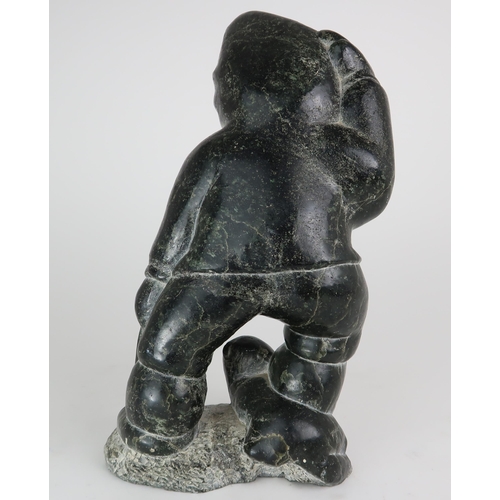 2950 - JOHNNY INUKPUK RCA (CANADIAN 1911-2007)INUK HOLDING ANIMAL Soapstone carving, inscribed indistinctly... 