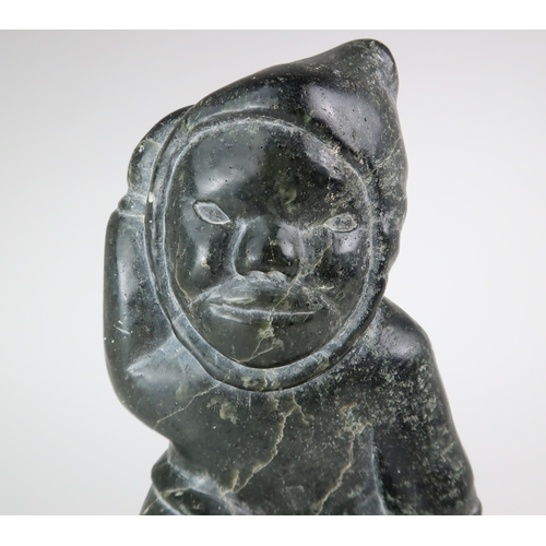 2950 - JOHNNY INUKPUK RCA (CANADIAN 1911-2007)INUK HOLDING ANIMAL Soapstone carving, inscribed indistinctly... 