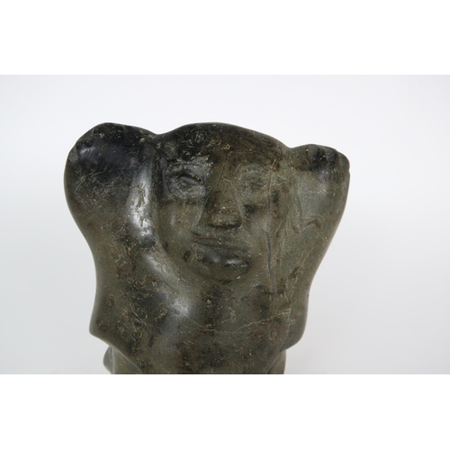 2952 - A 20TH CENTURY INUIT SOAPSTONE CARVING OF A FIGURE WITH HANDS ALOFT20.5cm high (8